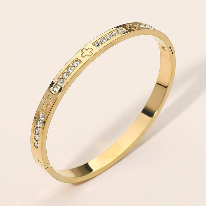 Stainless Steel CZ Accent Quatrefoil Engraved Hinged Bangle Bracelet: Silver