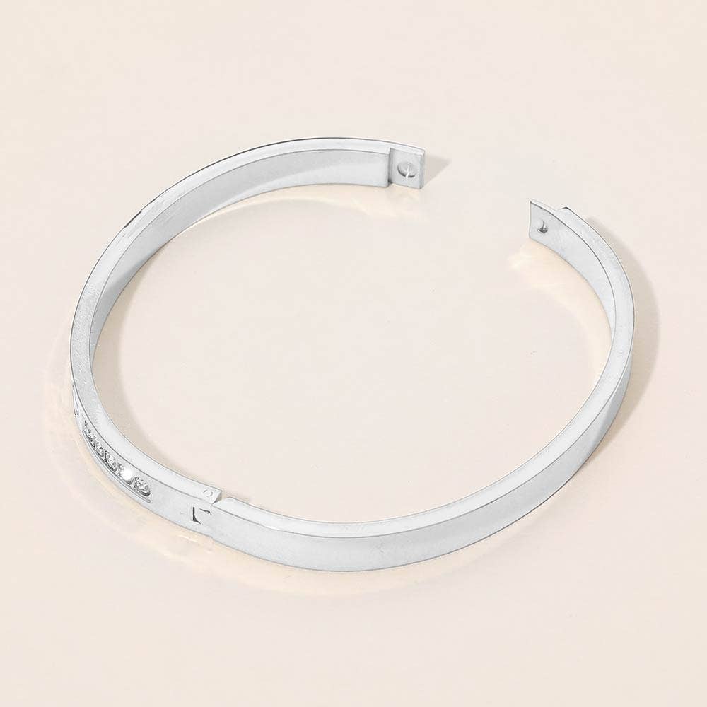 Stainless Steel CZ Accent Quatrefoil Engraved Hinged Bangle Bracelet: Silver