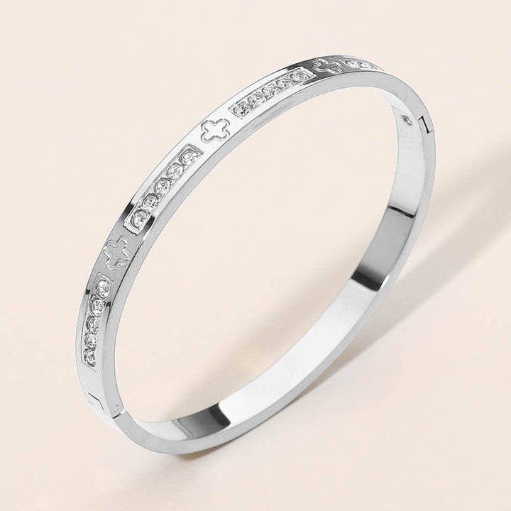 Stainless Steel CZ Accent Quatrefoil Engraved Hinged Bangle Bracelet: Silver