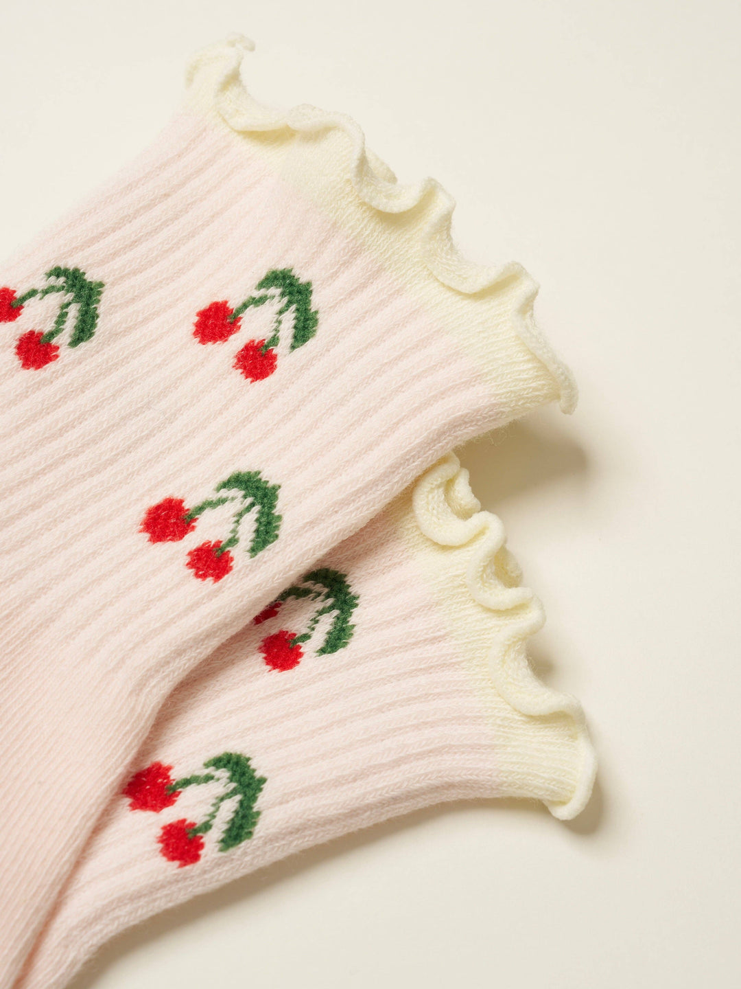 Cherry Ruffle Grip Sock: Baby Pink